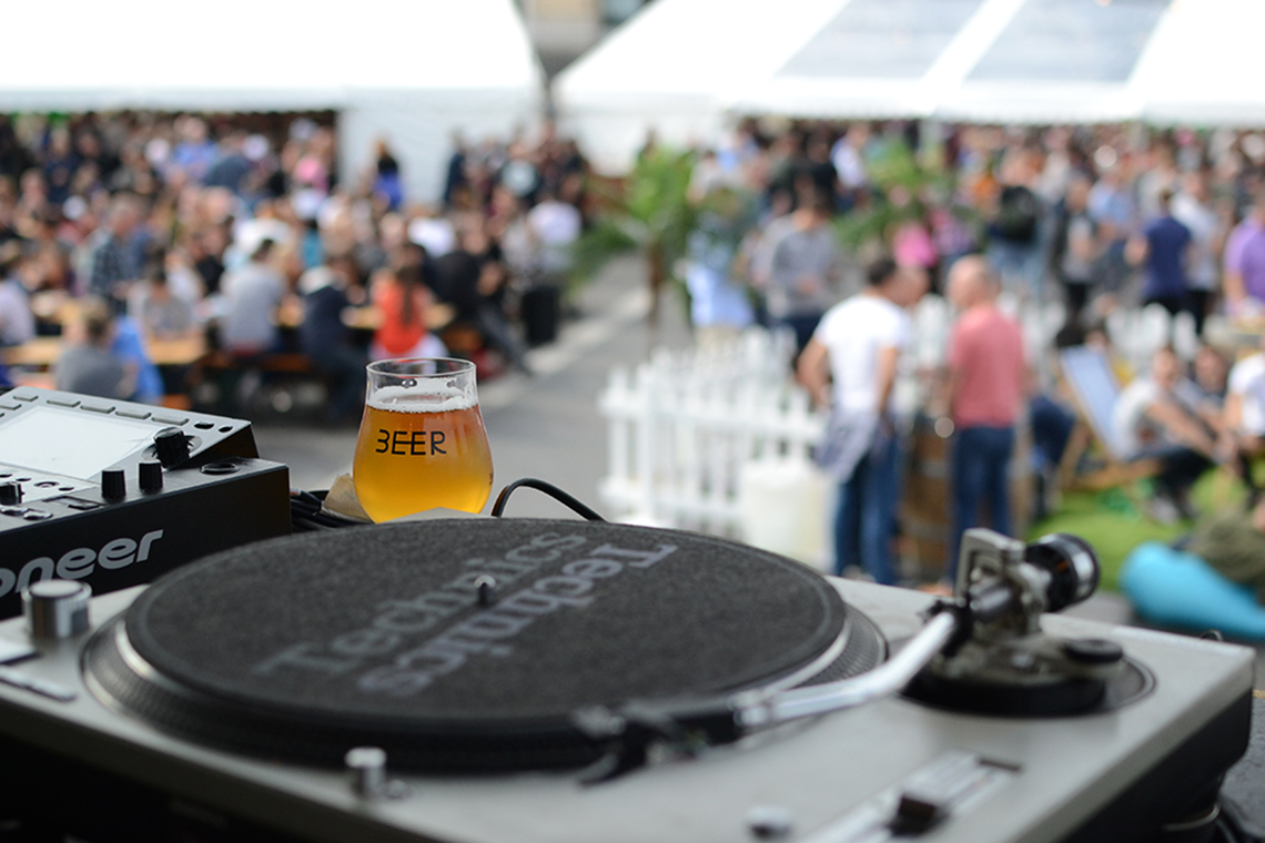 DJ decks and a glass of beer at Bristol Craft Beer Festival